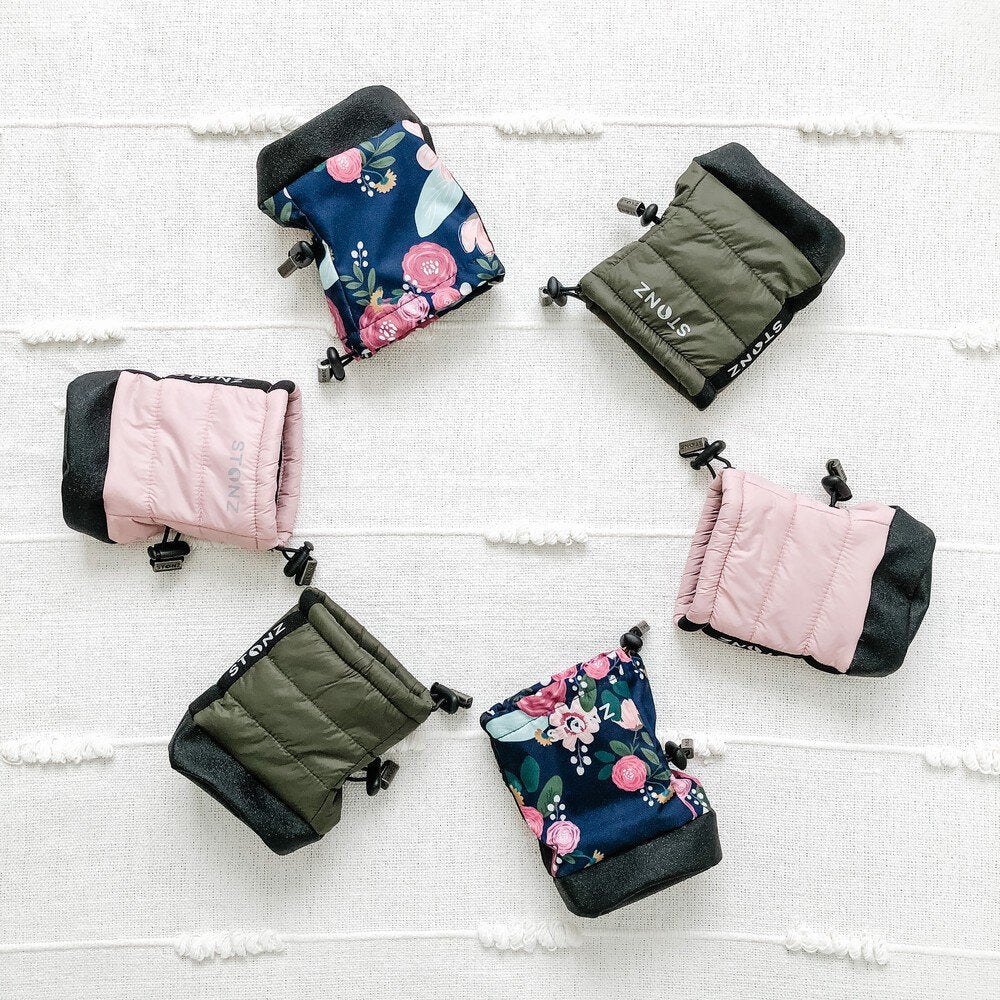 4. Flat lay of assorted Stonz Puffer Booties in pink, green, and floral designs