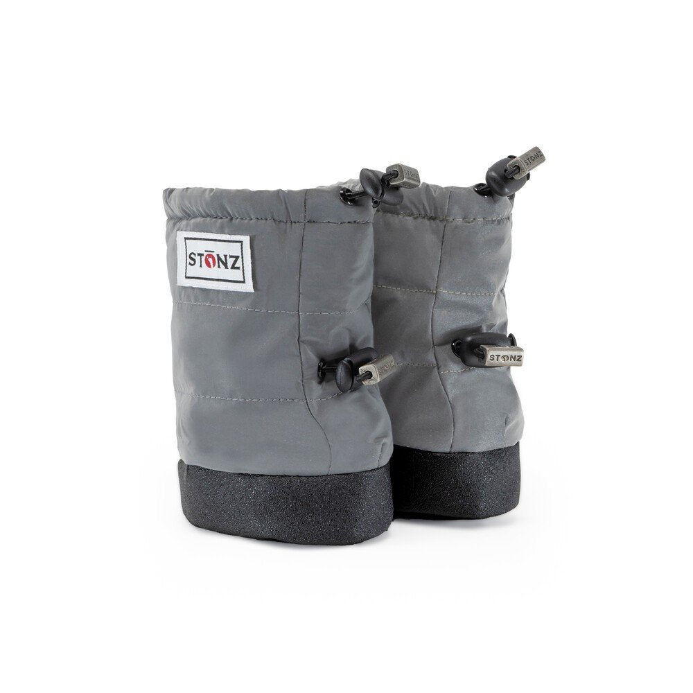 2. Grey Stonz Puffer Booties with black soles and elastic straps in studio setting
