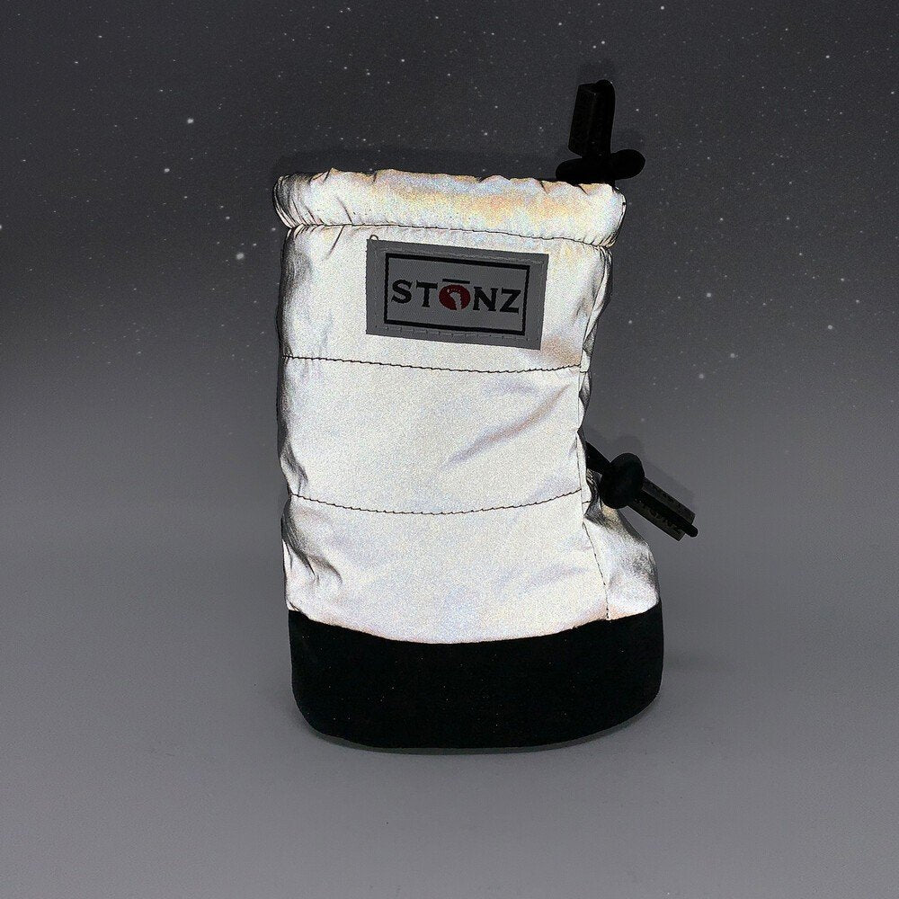 2. White Stonz Puffer Booties with black soles and logo patch in studio setting