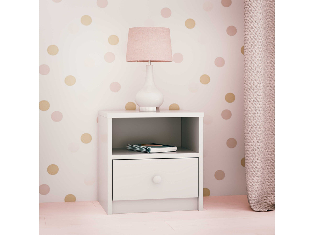 7. White bedside table with open shelf and drawer, styled with a lamp in a polka dot room