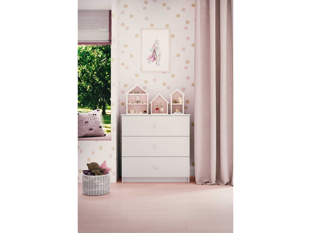 13. Babydreams chest of drawers in a child's room with pink accents and decorative items on top