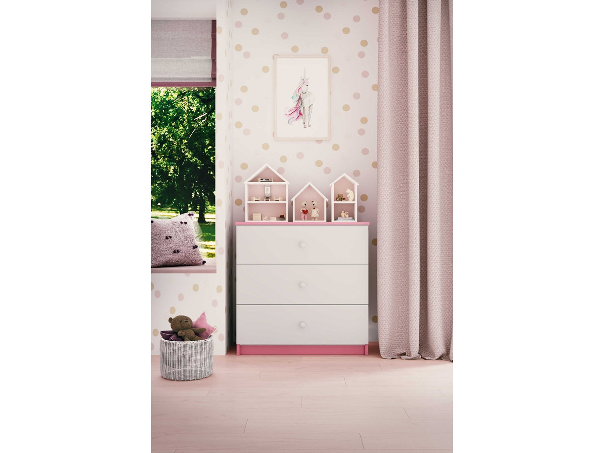4. Babydreams chest of drawers in a child's room with pink accents and decorative items on top