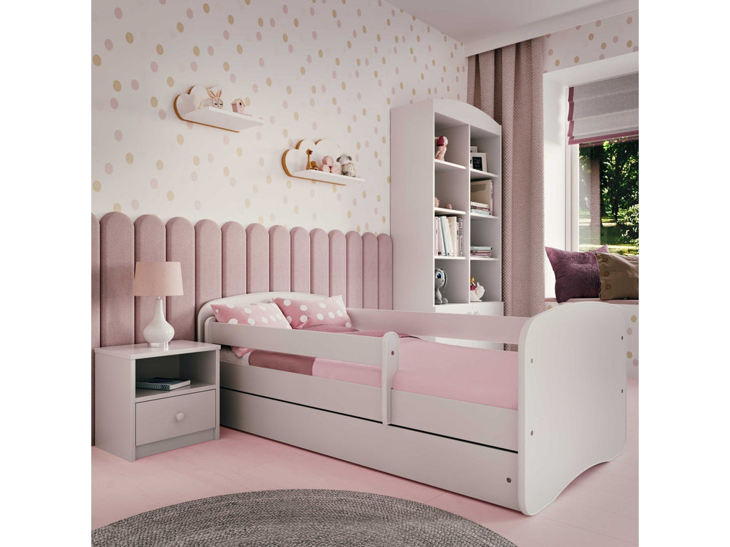1. Pink and white children's bed in a cozy bedroom with matching decor and furniture