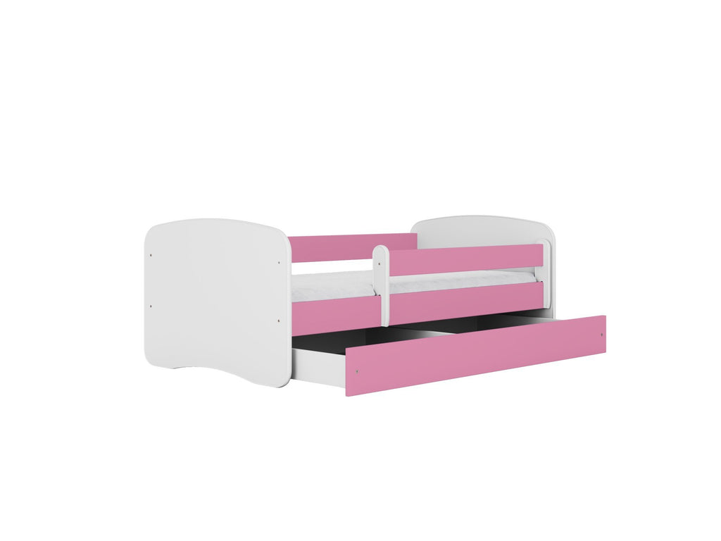 2. Pink and white children's bed with open storage drawer, shown in a studio setting
