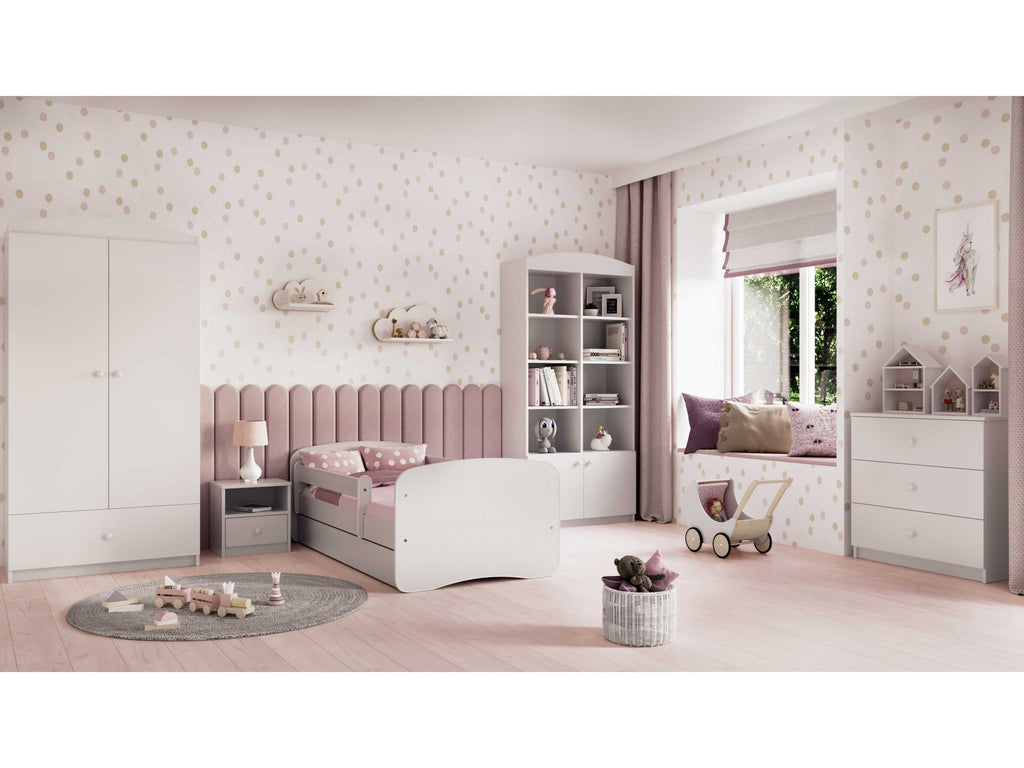 1. White children's bed in a stylish pink-themed bedroom with matching furniture and decor