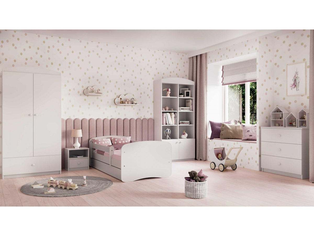 1. White children's bed in a stylish pink-themed bedroom with matching furniture and decor