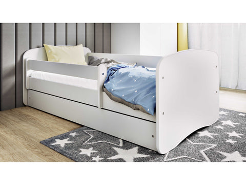 1. White children's bed with blue bedding in a modern bedroom setting
