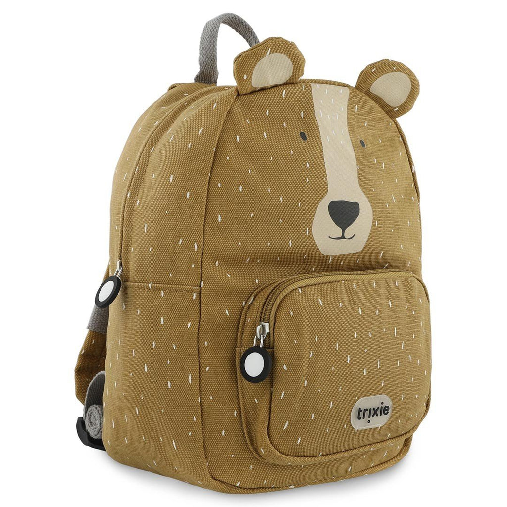 2. Side view of Trixie Baby Mr. Bear backpack showing bear face design and side pocket, brown color