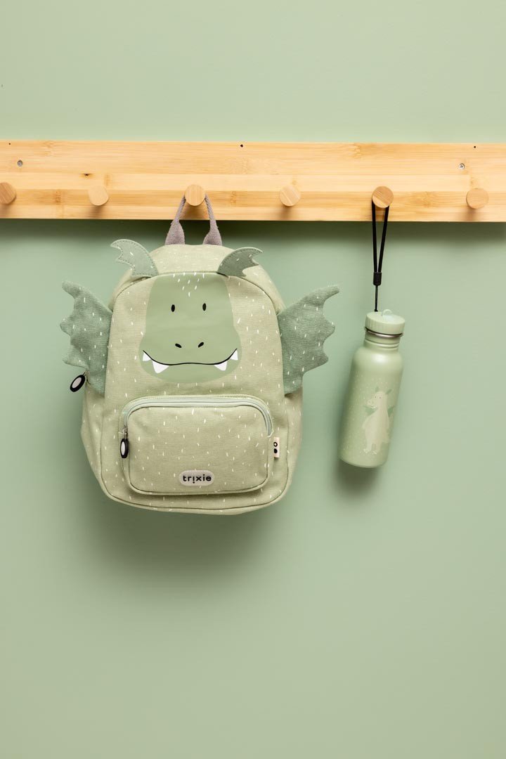 4. Green dragon backpack and matching water bottle hanging on wooden rack, green background