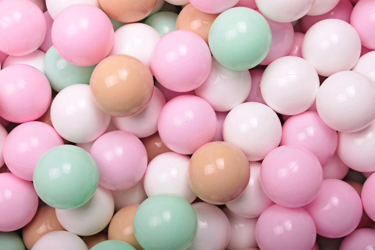 1. Close-up of MeowBaby ball pit balls in pastel pink, mint, beige, and white, showcasing shiny, flexible, non-toxic plastic suitable for children's sensory play and motor skill development.