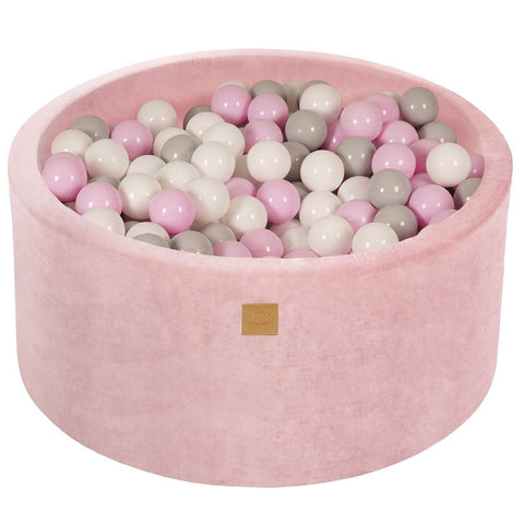 1. Light pink velvet ball pit filled with pink, white, and grey balls, designed for children's play and sensory development, featuring a soft, anti-allergic foam structure by MeowBaby.