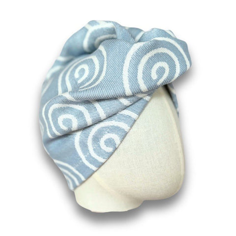 2. Blue and white patterned bamboo-cotton hair turban from Patulove displayed on mannequin head with clean background