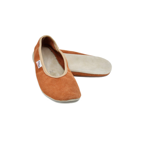 3. Studio image of terracotta barefoot slippers by Hip-Hop, showing upper and sole made from high-quality leather