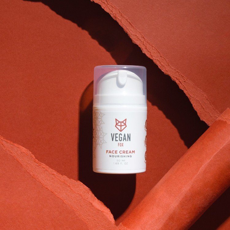 2. Vegan Fox nourishing face cream bottle on red background, showcasing product design