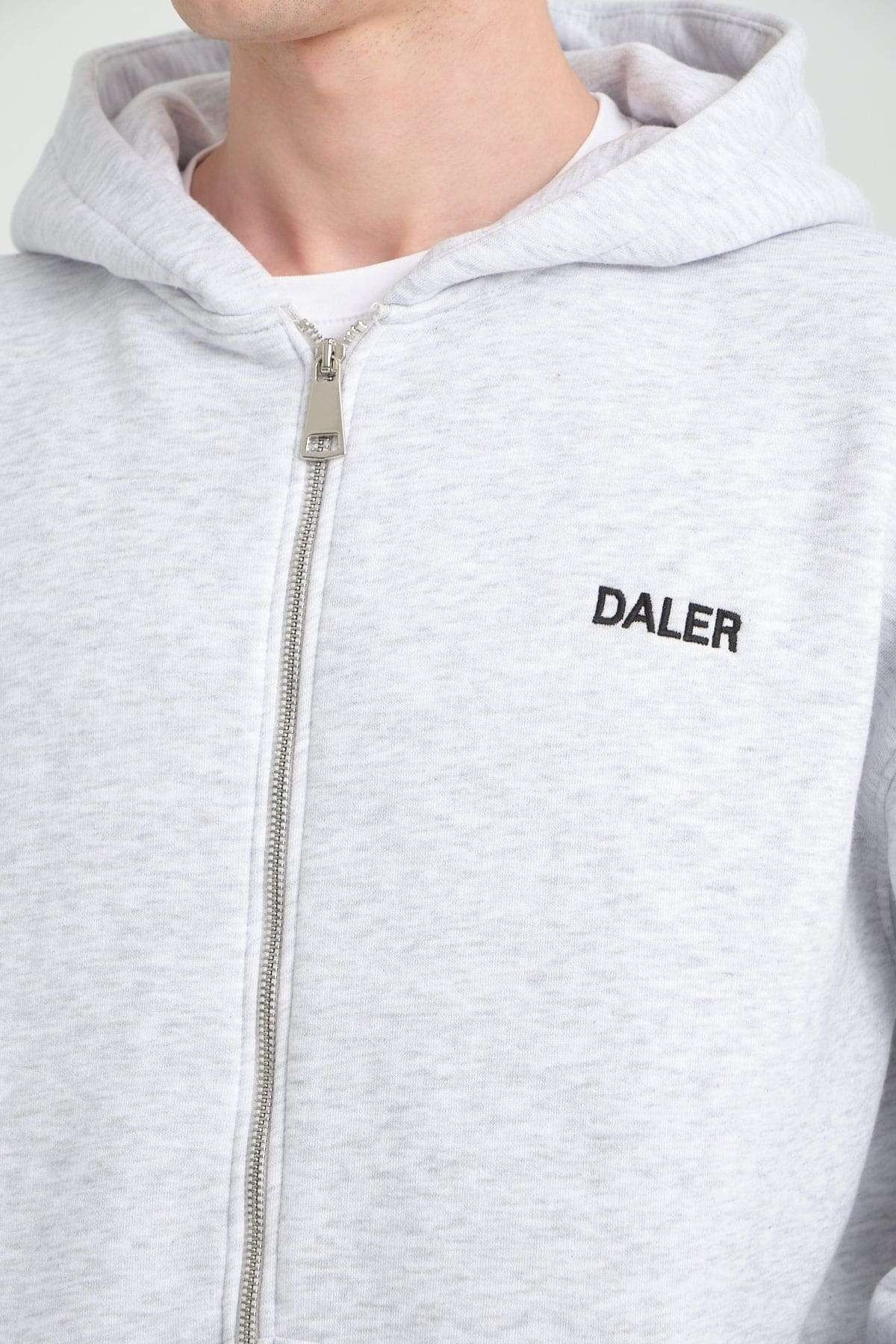 3. Close-up of grey melange DalerClo hoodie showing DALER embroidery and zipper detail