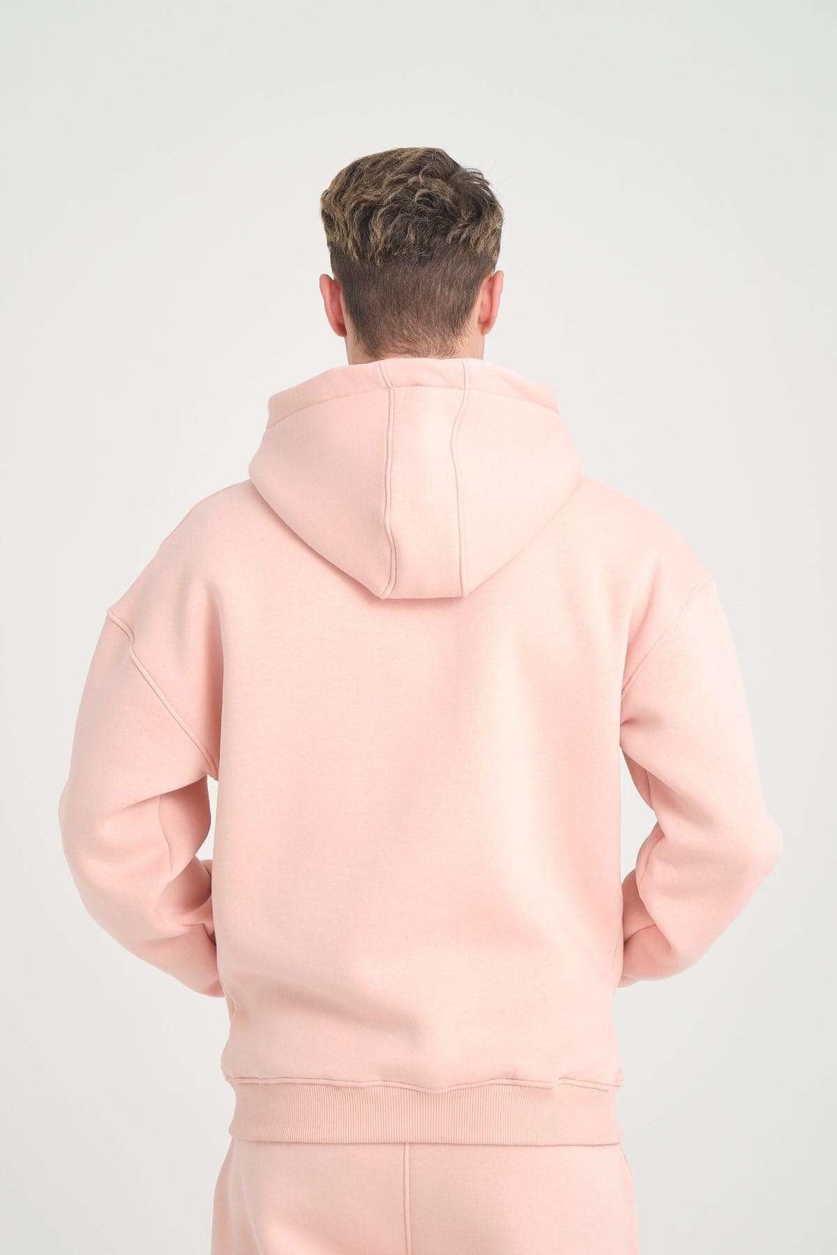 1. Back close-up of pink oversized zipper hoodie showing hood and shoulder details, studio background