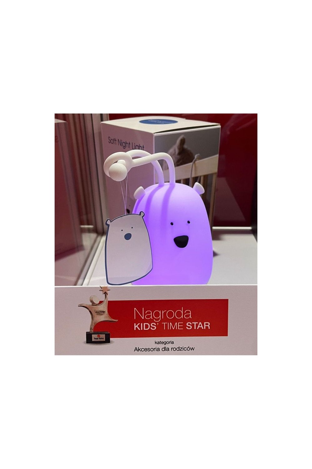 4. Purple glowing bear-shaped night light displayed with Kids' Time Star award signage