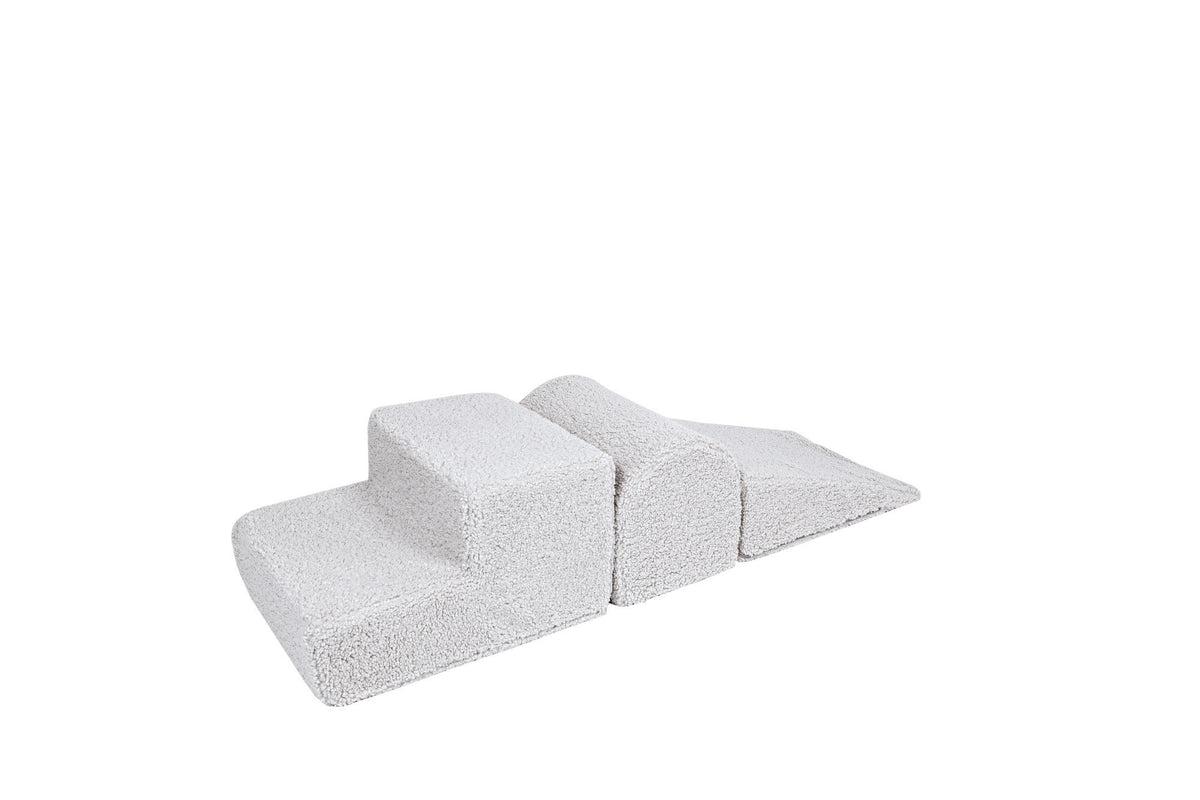 2. Off-white corduroy children's playset with three modular shapes on a white background, designed for creative play and easy cleaning with removable covers.