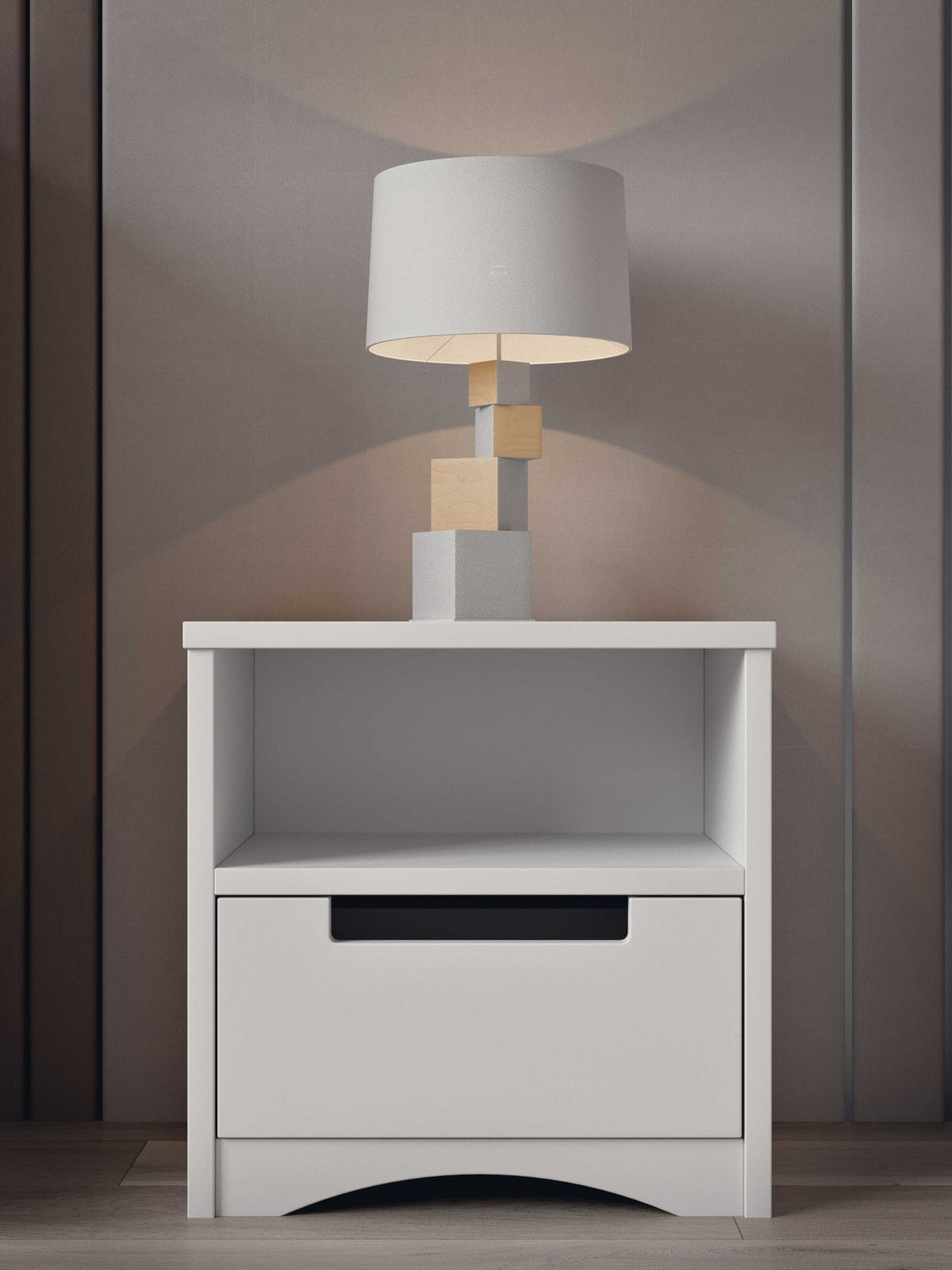 1. White bedside table with lamp on top, in a stylish room setting with wooden panel background