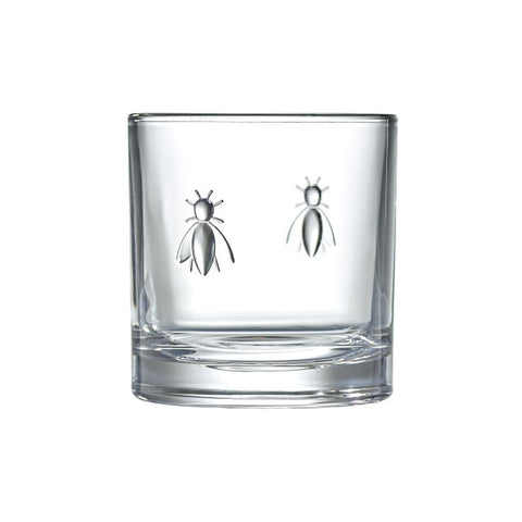 3. Close-up of a single La Rochère Bee Whiskey Glass with embossed bee design, highlighting the intricate detail and transparent glass material