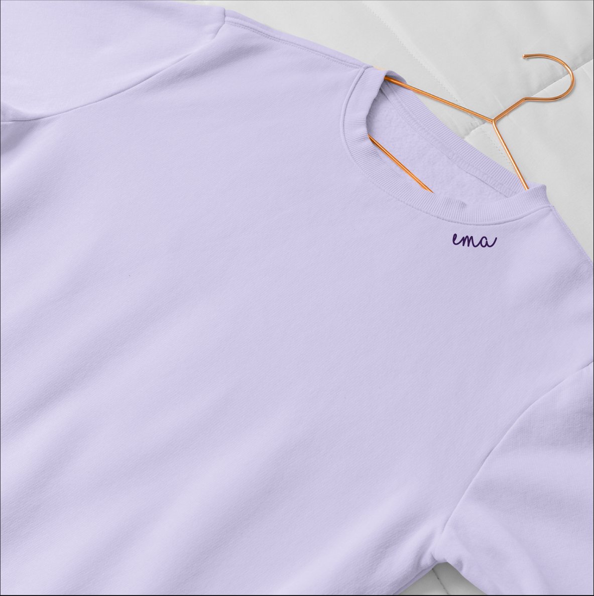 3. Lilac embroidered collar organic cotton sweatshirt by Beebila on hanger, close-up