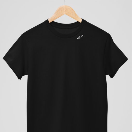 2. Woman and child wearing white embroidered collar organic cotton t-shirts in a playful setting