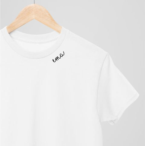 5. White unisex embroidered collar organic cotton t-shirt on hanger in studio setting