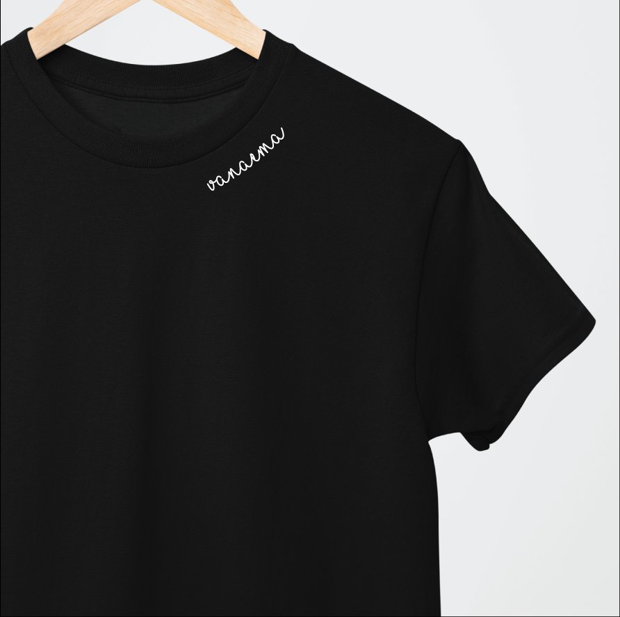 2. Black Beebila embroidered collar organic cotton t-shirt on hanger, showing white embroidery detail