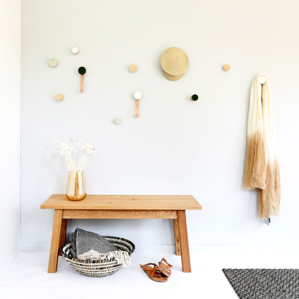 2. Lifestyle image of 5mm Paper wall hooks in an entryway with a bench, highlighting decorative use