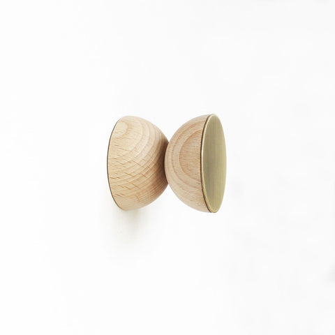 5. Three beech wood and brass wall hooks by 5mm Paper, studio setting with necklace hanging