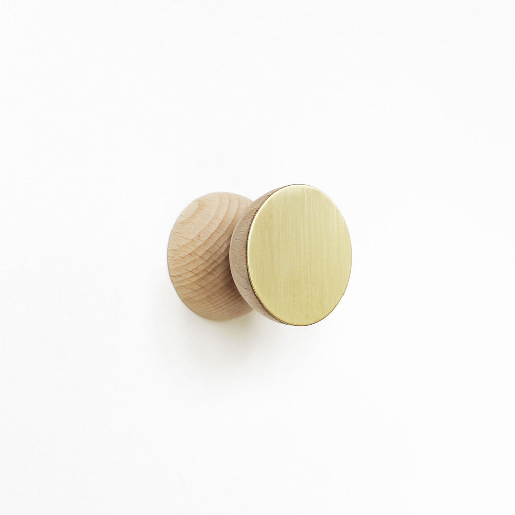 3. Single beech wood and brass wall hook by 5mm Paper, studio front view