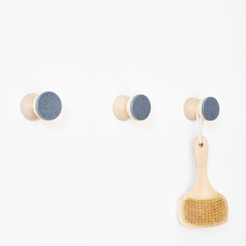 2. Beech Wood & Ceramic Wall Hooks with blue black specks, shown with a hanging brush
