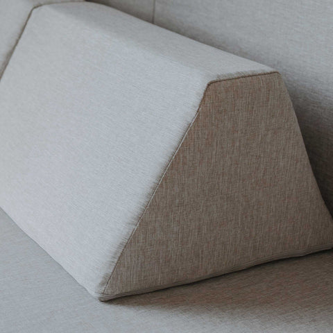 5. Close-up of trapezoidal pillow from beige Monboxy play mattress set showing fabric texture