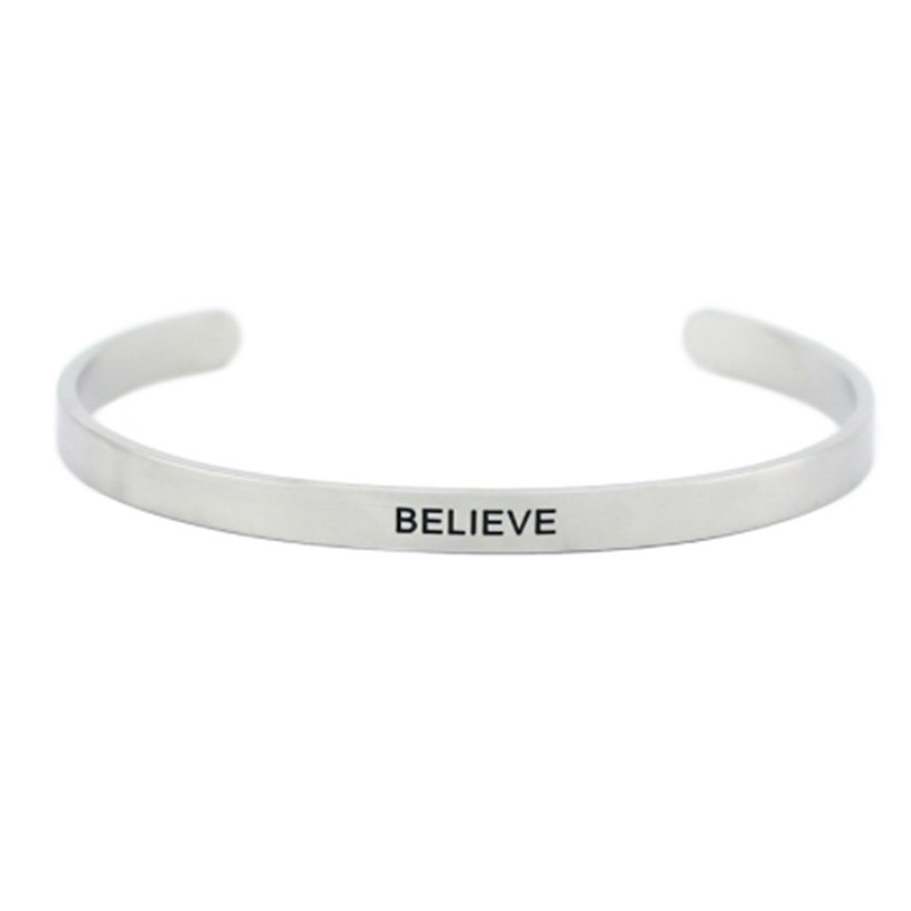 1. Men's Olla 'Believe' bracelet in polished stainless steel with deep-engraved inspirational message, shown in studio setting
