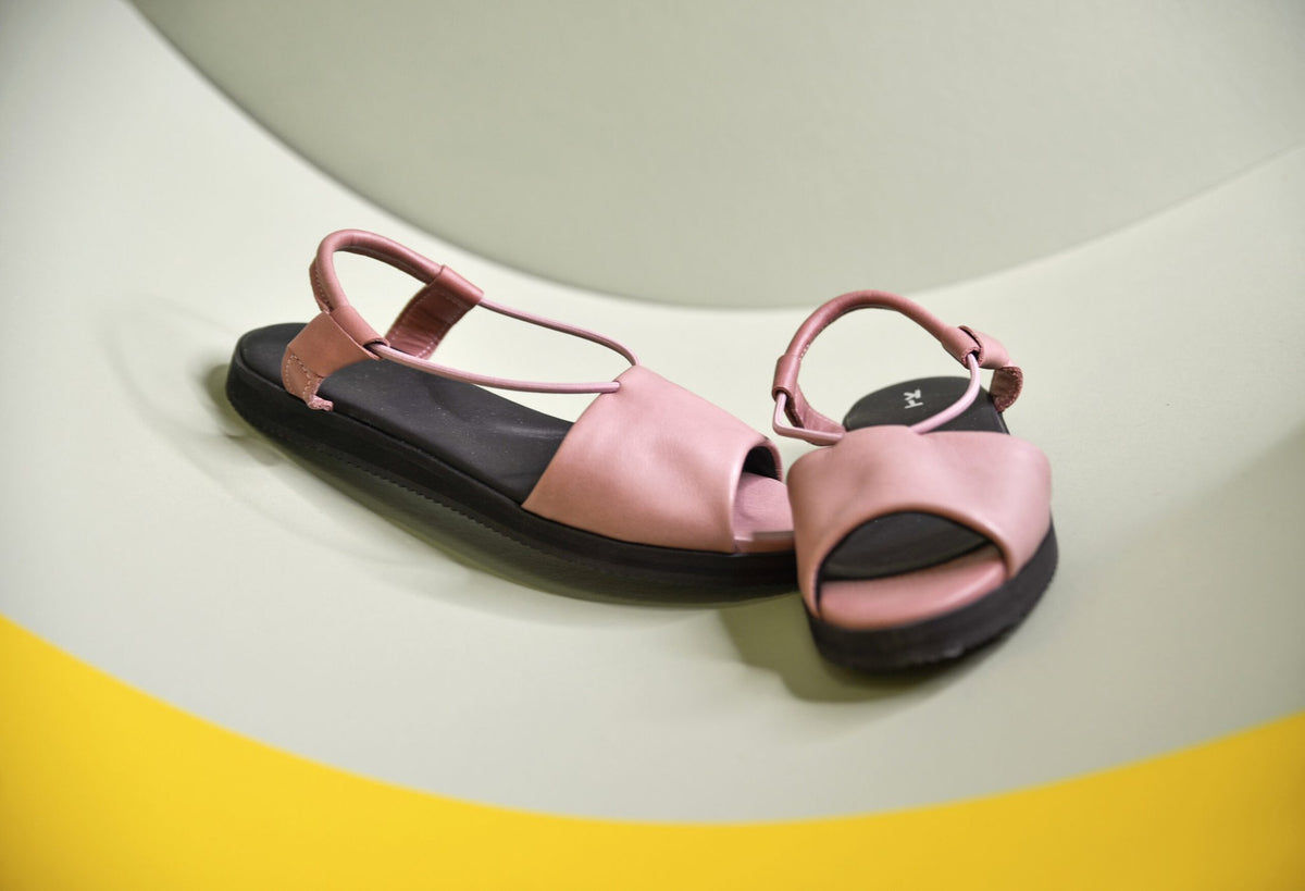 2. Lifestyle image of pink Berlin sandals by Omaking, showcasing ergonomic design and leather upper
