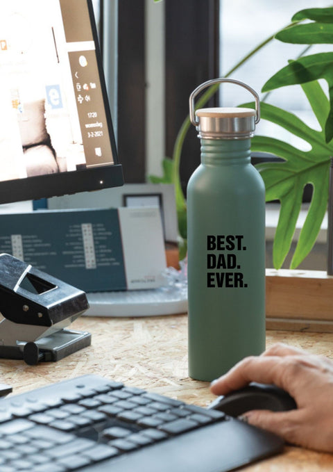 1. Matte stainless steel thermos bottle with 'BEST. DAD. EVER.' text on desk near computer, featuring metal handle and bamboo lid, ideal for office use.