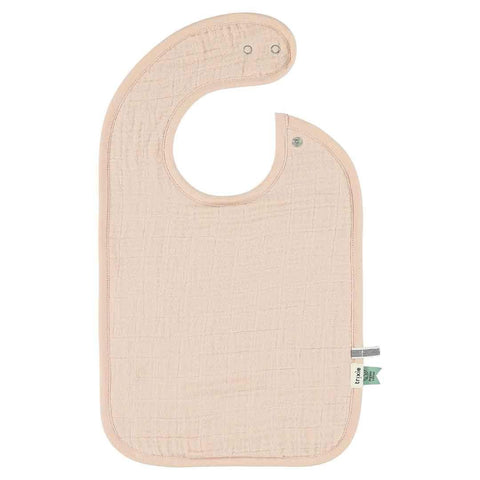 2. Single solid color Trixie Baby bib in light pink with adjustable snaps, made from organic cotton