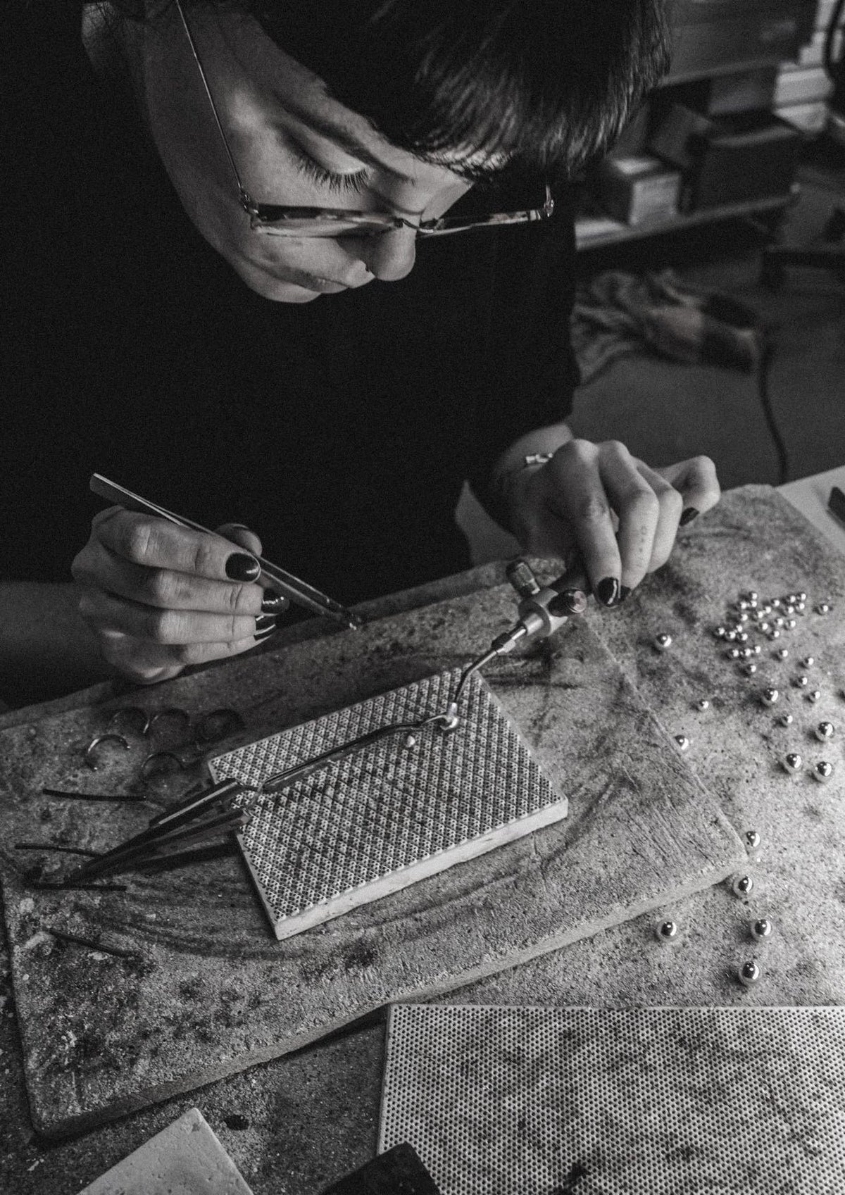 9. Artisan working on NO MORE Big Bomb Multisize Ring in silver, emphasizing sustainable and handmade production