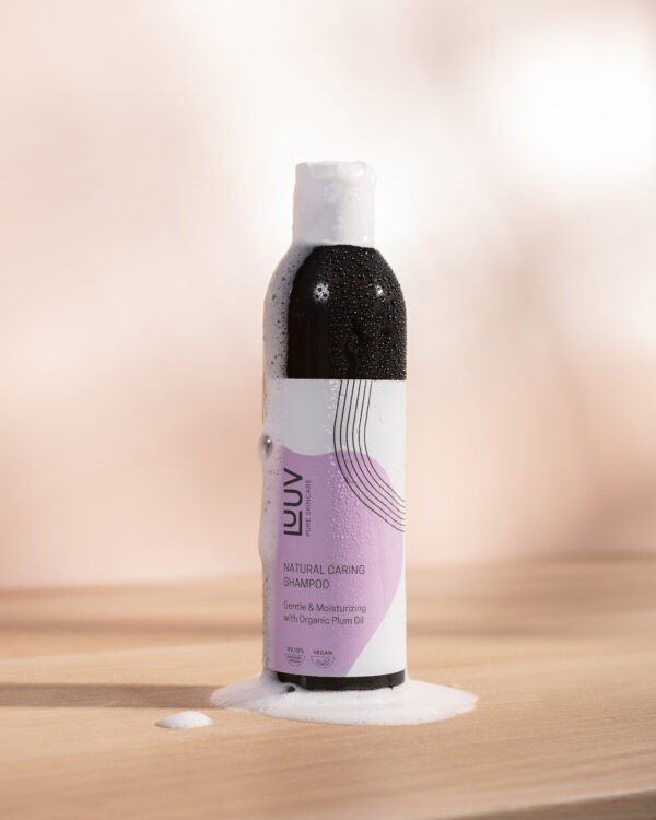 1. LUUV Natural Nourishing Shampoo with Plum Oil, 250 ml, shown with foam on wooden surface