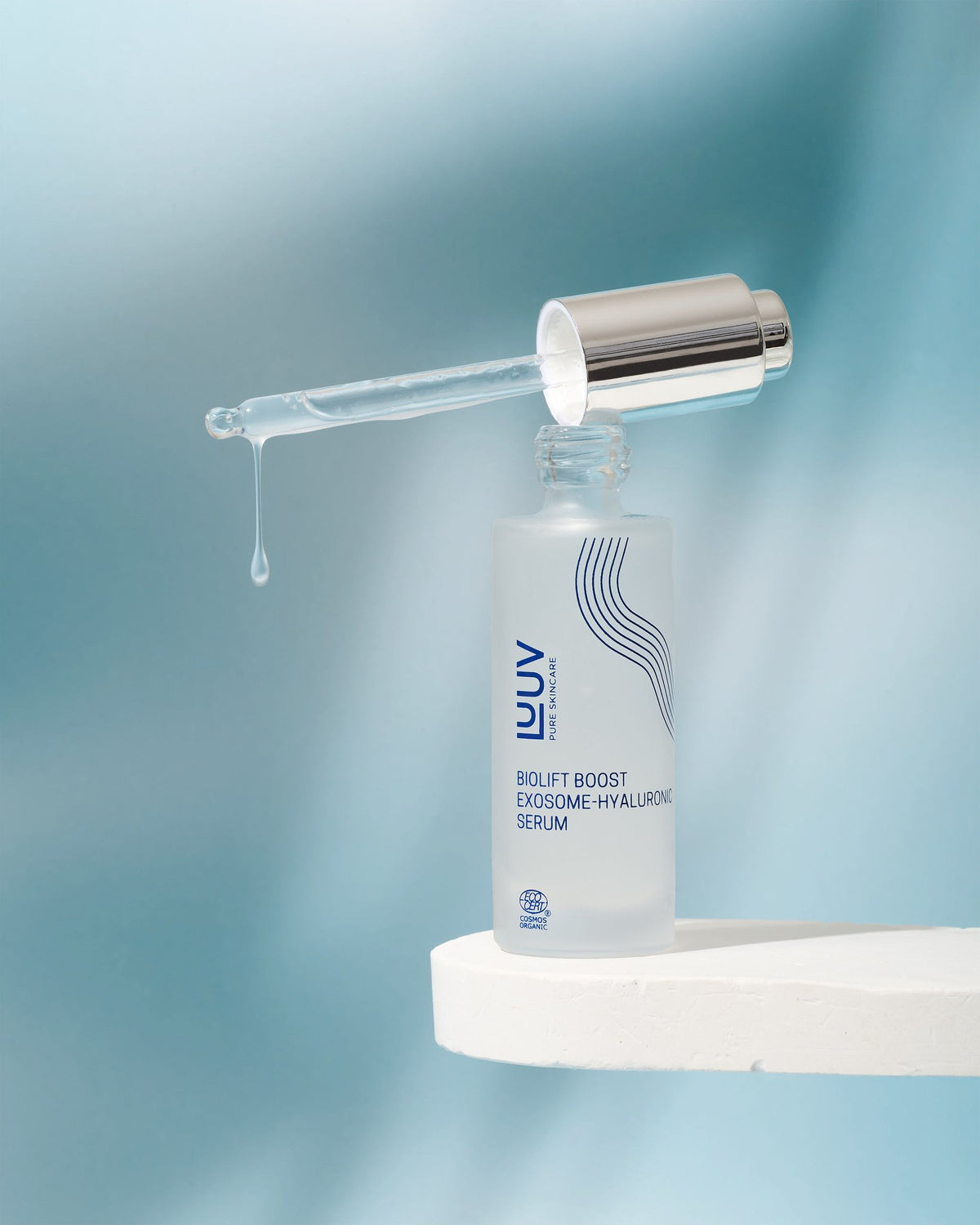 1. LUUV BioLift Exosome-Hyaluronic Serum with dropper, shown on a white surface against a blue background
