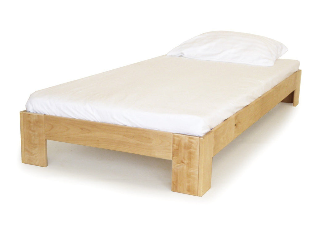 2. Single birch wood bed frame with white bedding, highlighting seamless construction and eco-friendly finish, in a studio setting