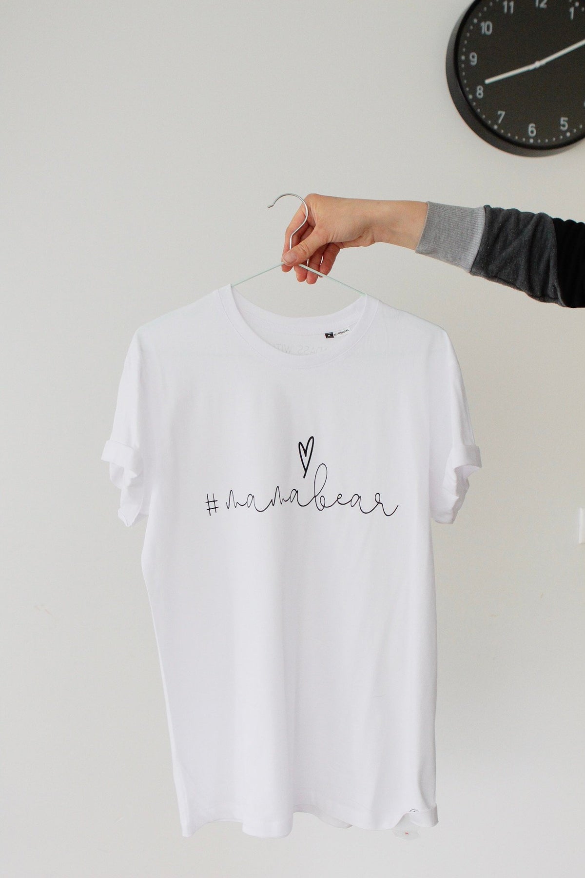 1. White Mamabear T-shirt by Black Giraffe Brand with rolled-up sleeves, shown on hanger