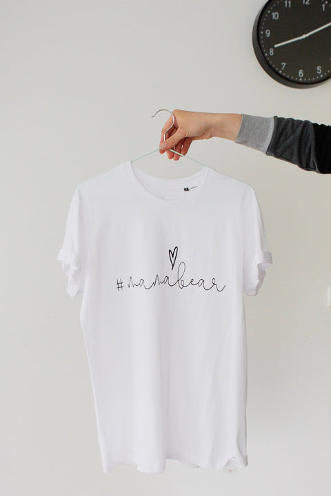 1. White Mamabear T-shirt by Black Giraffe Brand with rolled-up sleeves, shown on hanger