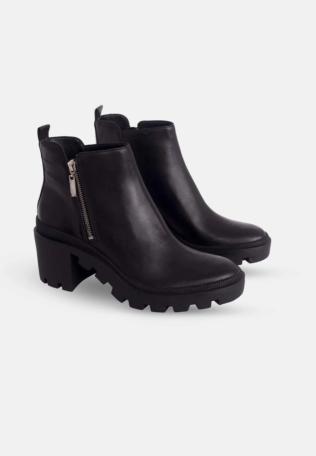 3. Close-up of women's black goat leather ankle boots with side zipper and block heel