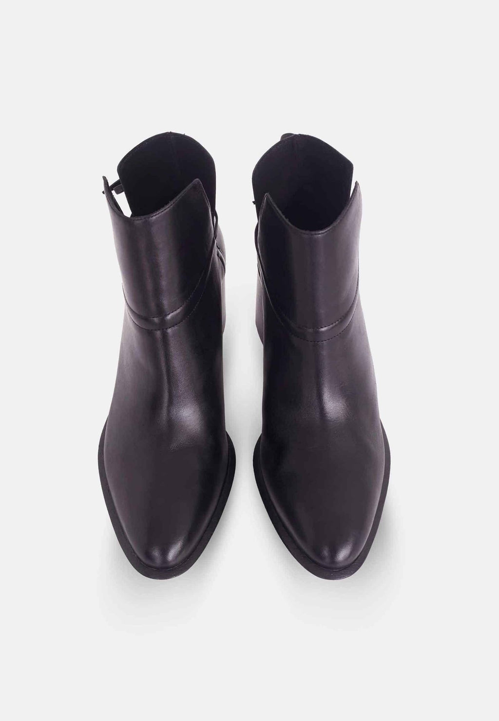 3. Top view of women's black leather ankle boots with pointed toe and block heel on white background