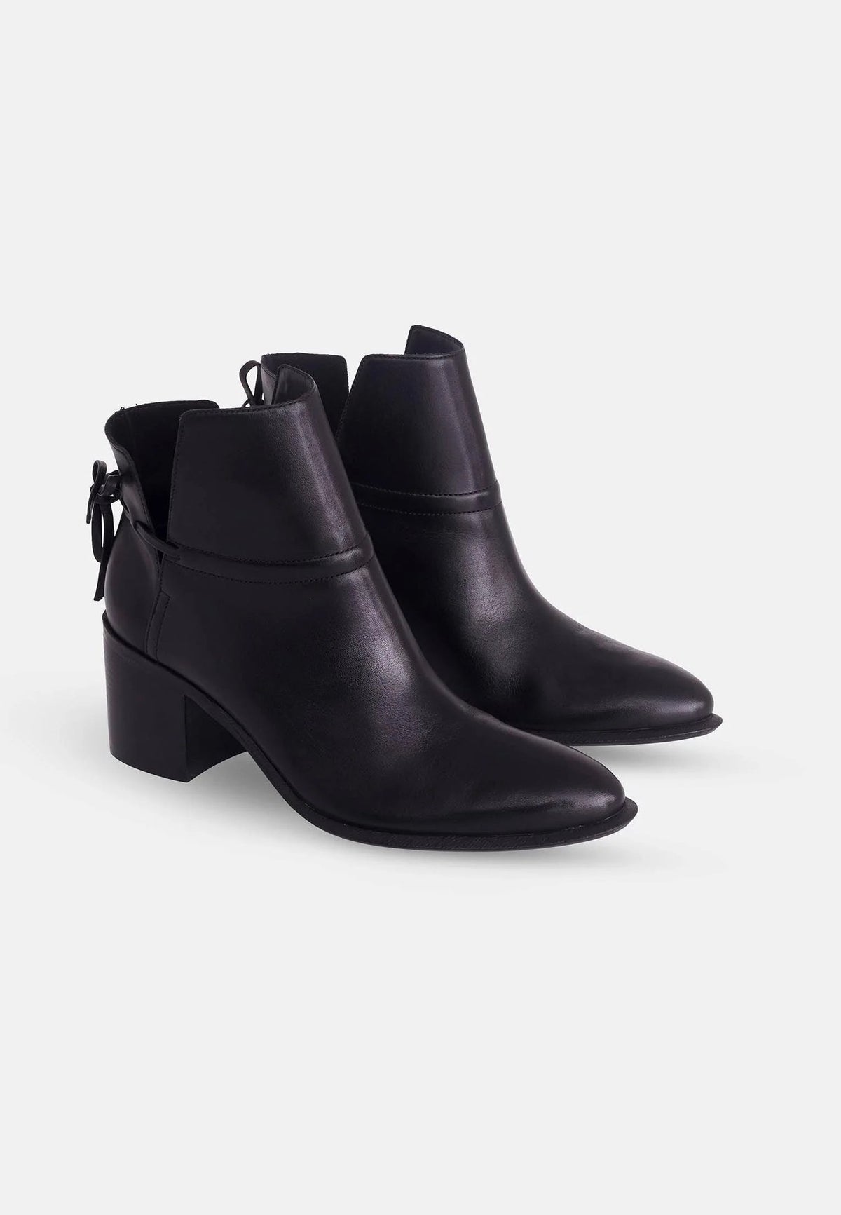 2. Pair of women's black leather ankle boots with block heel shown in three-quarter view on white background