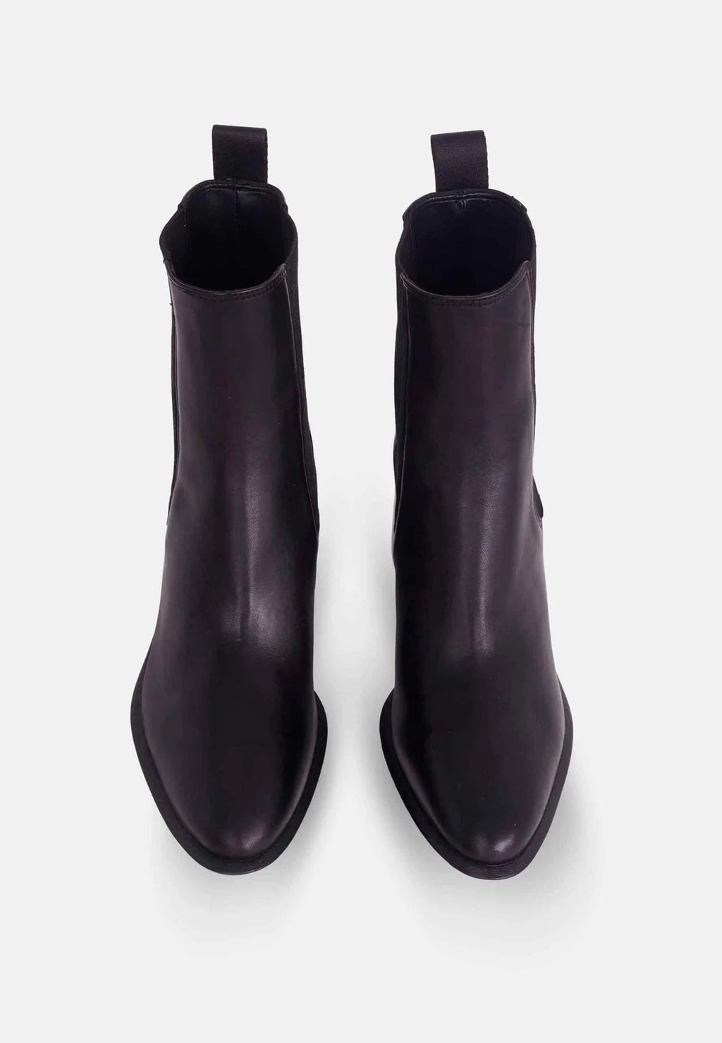 2. Top view of black leather Chelsea ankle boots showing rounded toe and pull tab