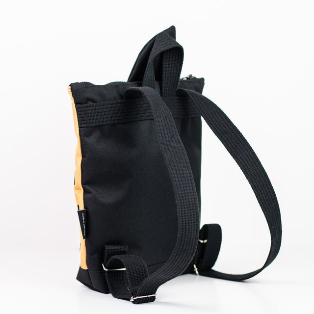 8. Back view of Muni apple backpack, displaying adjustable shoulder straps and sturdy construction