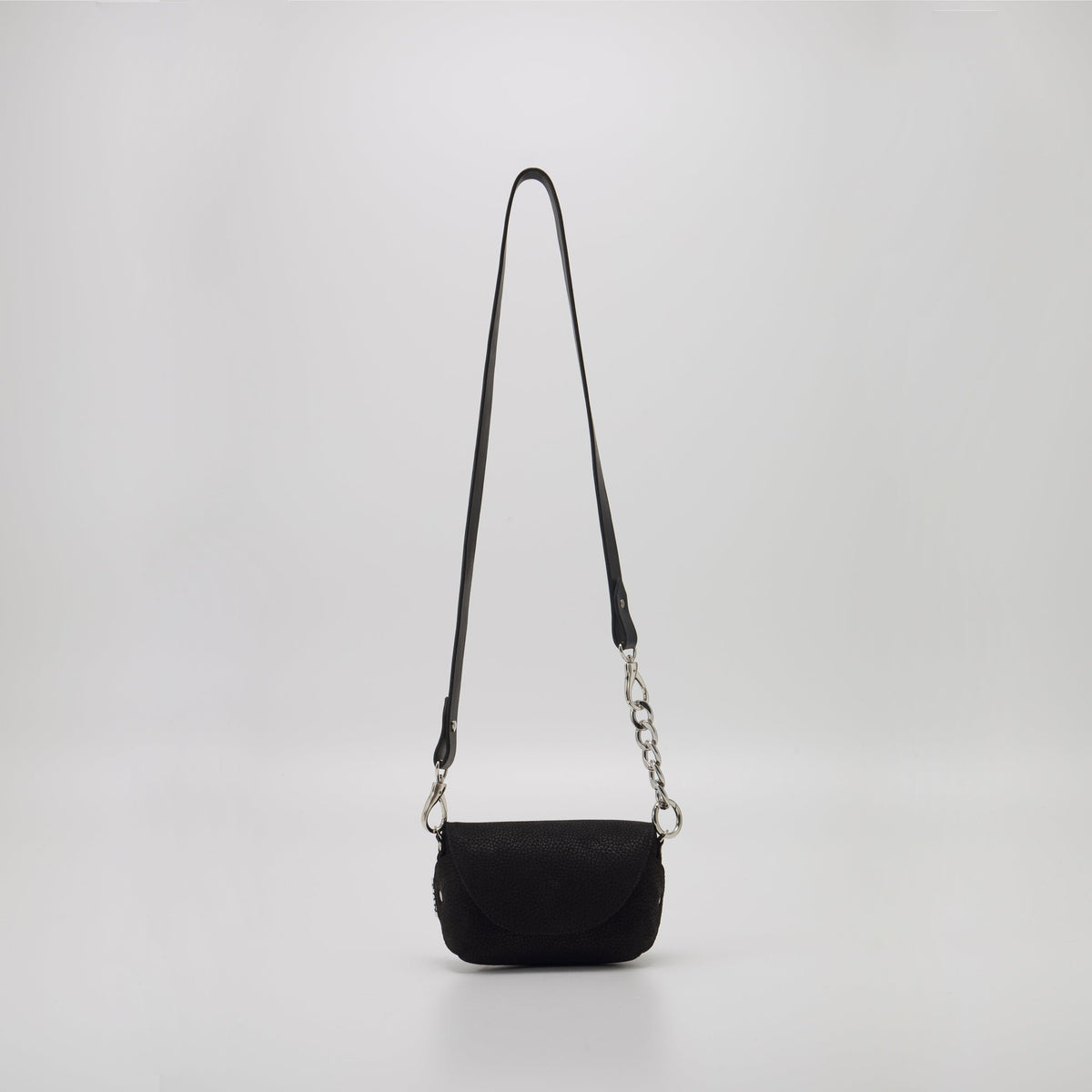 10. Studio shot of Daz Studio black leather shoulder bag with long strap, highlighting minimalist design