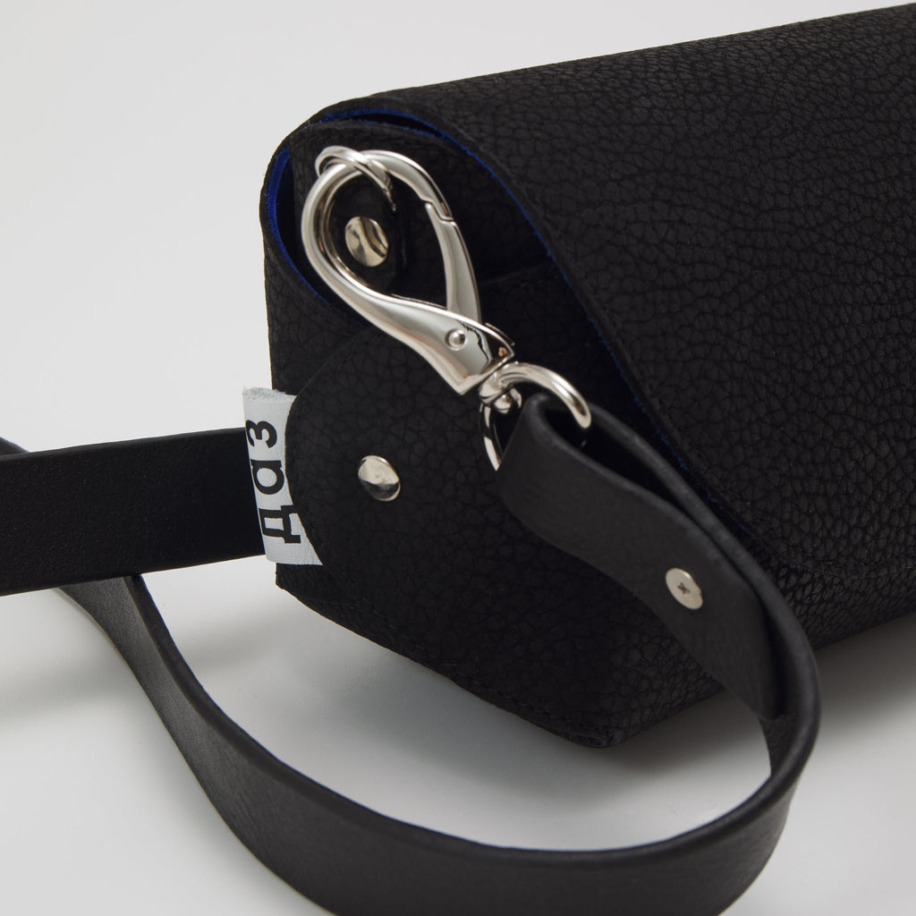 6. Detail of Daz Studio black leather shoulder bag with adjustable strap and silver clasp